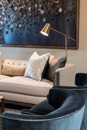 Table Lamp besides Grey Sofa with Fabric Pillows by R Designs, LLC