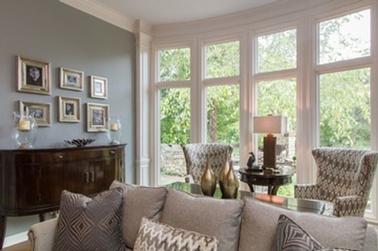 Sofa with Throw Pillows near Window by R Designs, LLC -  Interior Decor
